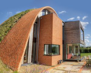 Garden view of Crossway, a Para 80 (PPS 7), energy efficient Passivhaus. Designed by Hawkes Architecture and featured on Channel 4's Grand Designs.