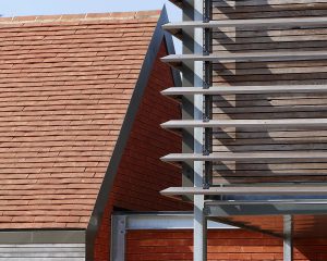 Kent peg tiles and English Sweet Chestnut bride soleil veil detail on Echo Barn, a Para 80 (Para 55), energy efficient passive house. Another grand design by Hawkes Architecture.