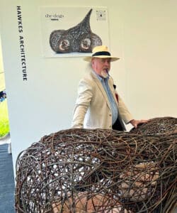 Bill Bailey with Hawkes Architecture's entry, The dogs, for Goodwoof's, Barkitecture at Goodwood in May 2023.