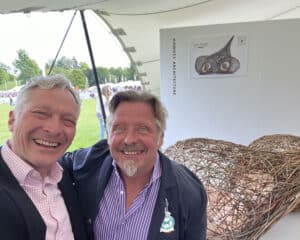 Richard with Charley Boorman and Hawkes Architecture's entry, The dogs, for Goodwoof's, Barkitecture at Goodwood in May 2023.