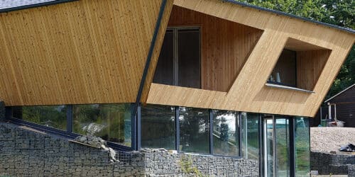 pondside elevation at Brooks Barn, a Para 84 energy efficient passive house. Another grand design by Hawkes Architecture.